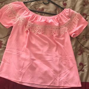 Pink off the shoulder shirt really nice design .